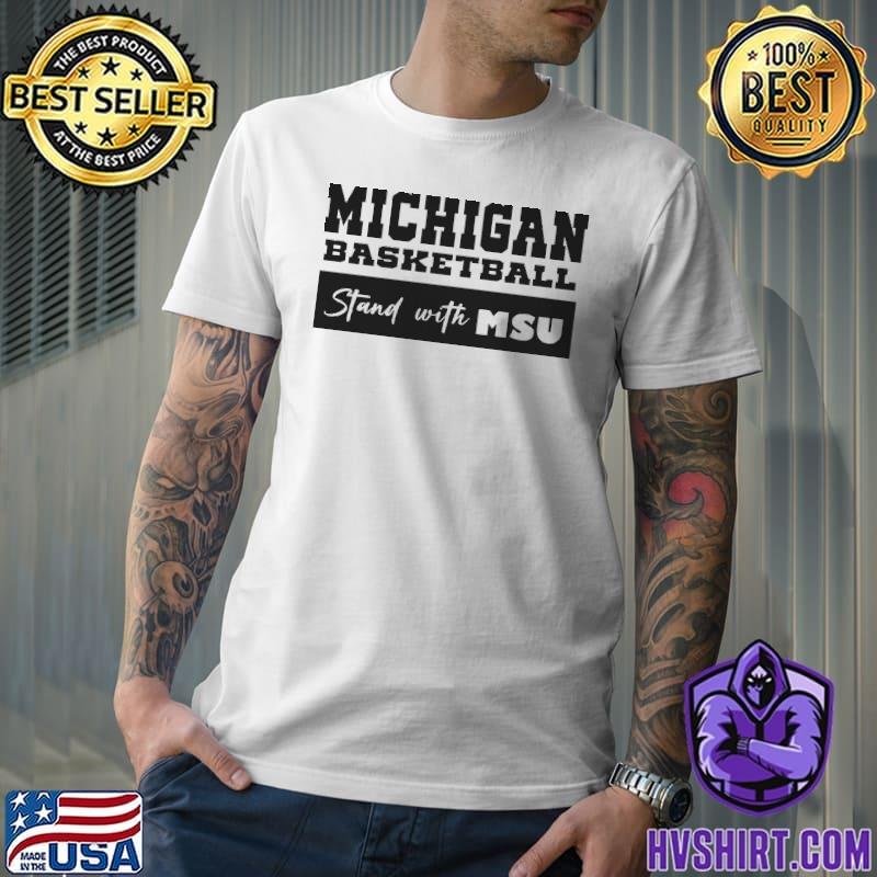 Michigan basketball stand with MSU shirt